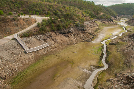 The Ponsul River is a affluent of the Tejo River, in Portugal, and is a very large river. At this time it is completely dry, without water and with its bed cracked. Climate changeの写真素材