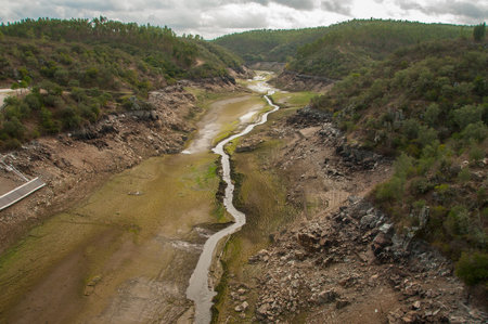 The Ponsul River is a affluent of the Tejo River, in Portugal, and is a very large river. At this time it is completely dry, without water and with its bed cracked. Climate changeの写真素材