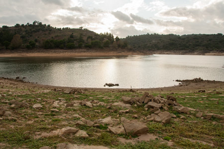Dam bed on the Tejo river, in Portugal, without water. It is possible to walk where there should be many cubic meters of waterの写真素材