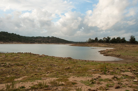 Dam bed on the Tejo river, in Portugal, without water. It is possible to walk where there should be many cubic meters of waterの写真素材