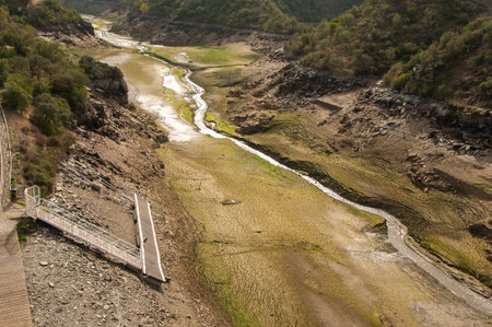 The Ponsul River is a affluent of the Tejo River, in Portugal, and is a very large river. At this time it is completely dry, without water and with its bed cracked. Climate changeの写真素材