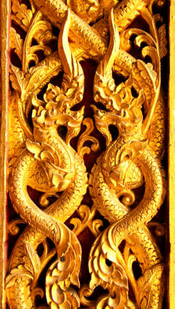 Window wood carving i thai templeの写真素材