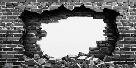 This black and white image features a large hole in a weathered brick wall, revealing stark space beyond. The intricate texture enhances the scene, compellingly drawing the viewers gazeの素材