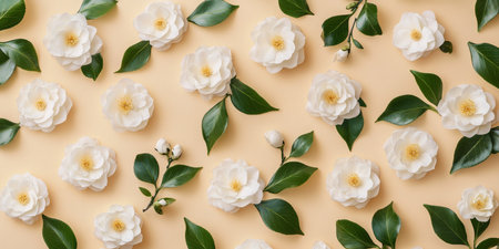 This beautiful flat lay features fragrant jasmine flowers and lush green leaves against a beige backdrop, creating a tranquil and captivating atmosphere that evokes serene beauty and natural eleganceの素材