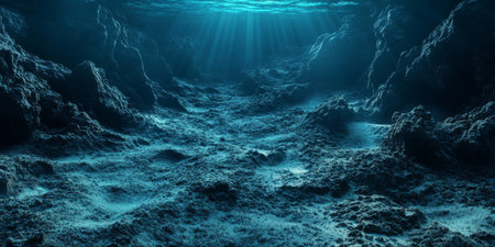 An enchanting and mesmerizing underwater scene showcasing a rocky seabed brilliantly illuminated by warm sunlightの素材