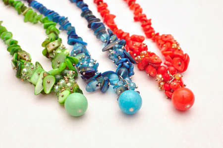 Vivid color handmade natural stone necklace isolated on white backgroundの写真素材