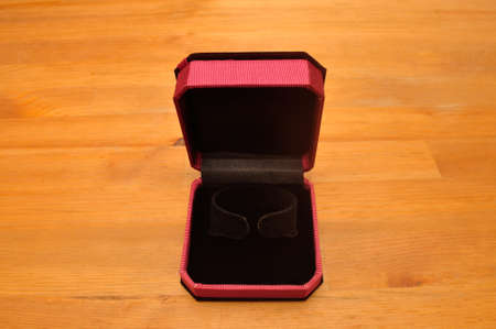 Open velvet jewelry box for bangle on woodの写真素材