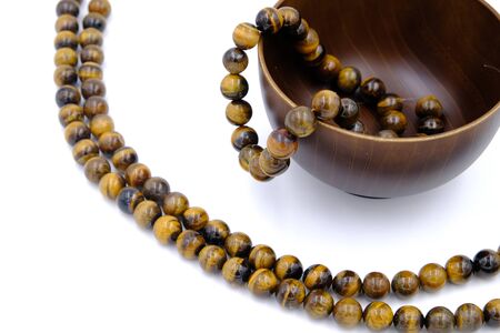 tiger eye stone beads isolated on white backgroundの写真素材