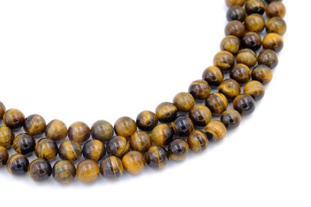 tiger eye stone beads necklace isolated on white backgroundの写真素材