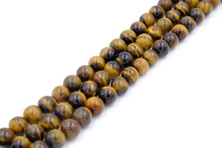 tiger eye stone beads necklace isolated on white backgroundの写真素材