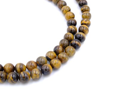 tiger eye stone beads necklace isolated on white backgroundの写真素材