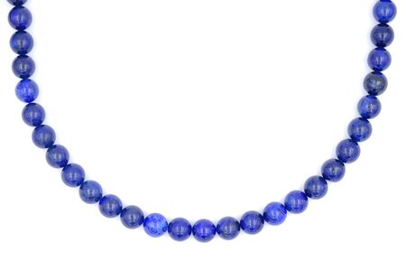 Single layer of blue lapis lazuli natural stone necklace isolated on white backgroundの写真素材