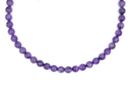 Single layer of purple amethyst natural stone necklace isolated on white backgroundの写真素材