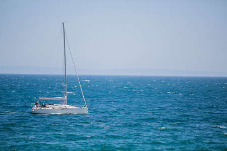 Photo of the Sea view and a boat with waves with relaxation