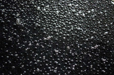 Photo of the Bubbles on a black backgroundの写真素材