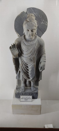 Taxila, Pakistan, September 11 2025 Buddha statue in attitude of reassurance from Dharmarajika 1st century AD ancient Gandhara Buddhist heritageのeditorial素材