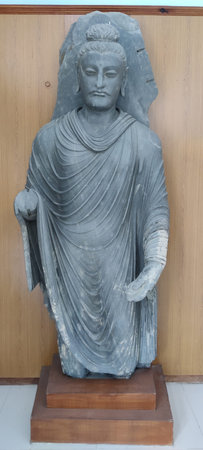 Buddha statue discovered from ancient ruins of Taxila Gandhara civilization preserved in original stone form, Taxila Pakistan September 11 2025のeditorial素材