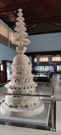 Cultural Ancient Carved Stone Stupa Preserved Behind Glass in Museum Hall Taxila pakistan september 11 2025のeditorial素材