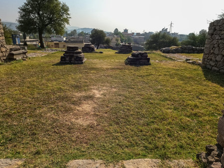 Entrance scene showing small weathered stone columns Jandial temple Taxila Pakistan, November 02 2025のeditorial素材