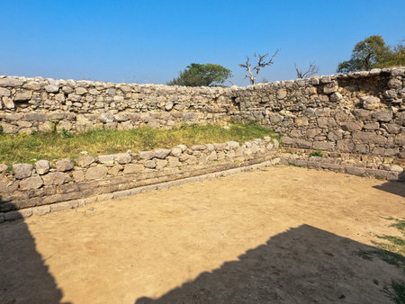 Courtyard interior revealing layered masonry portico and ritual traces at jandial temple taxila pakistanの写真素材