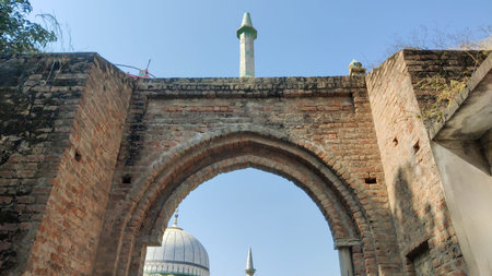 Mughal era Sangni Fort entrance arch in Pakistan showing ancient architecture and heritage of historic monumentの写真素材