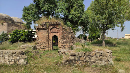 Damaged mausoleum wall inside Rawat Fort Rawalpindi Pakistan showing historic Mughal architecture...