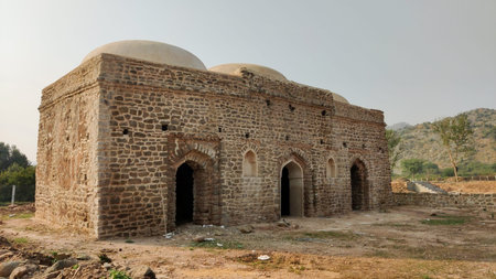 Historic mai qamro mosque built in stone with domes and arches, October 29 2025 Islamabad Pakistanのeditorial素材