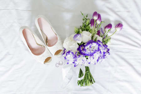Wedding details. shoes bride and hand bouquet,の写真素材