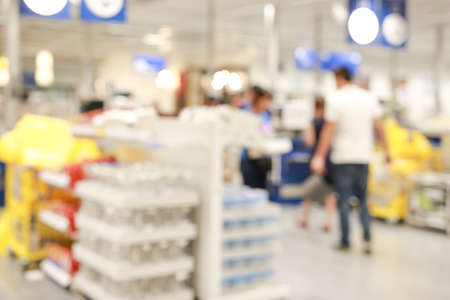 Abstract Blur image view of cashier with a line of people at the check-out counterの写真素材