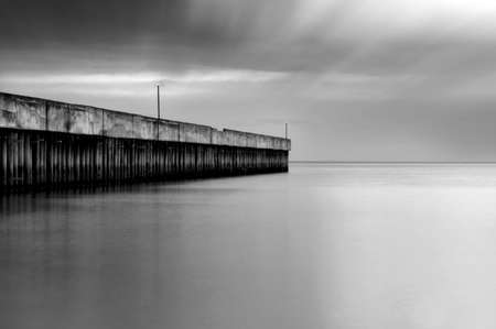 Beautiful long exposure seascape view with  jetty in black and white. Nature composition.
の写真素材