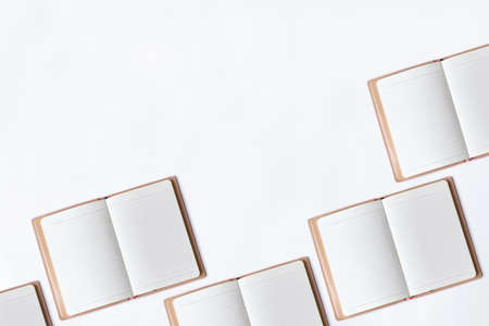 White office desk table with open diary.の写真素材