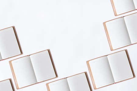 White office desk table with open diary.の写真素材