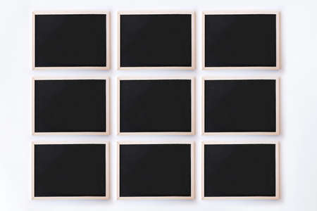 White office desk table with chalkboards. Top view with copy space, flat lay.の写真素材