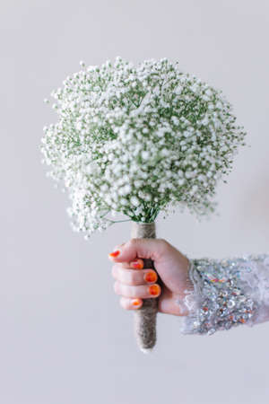 Brides hold the beautiful hand bouquet for her weddingの写真素材