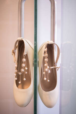 Beautiful white heels for brides. Wedding ceremonyの写真素材