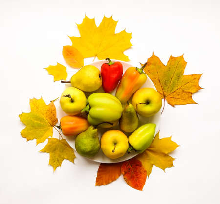 Stylish composition of colorful vegetables, fruits, autumn leaves. Top view on white background. Autumn flat layの写真素材