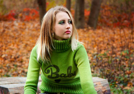 Pretty girl in autumn forestの写真素材