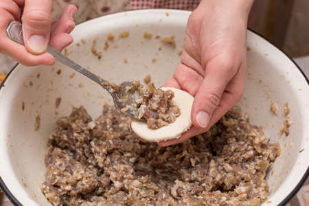 Cooking dumplings with minced meat at home.