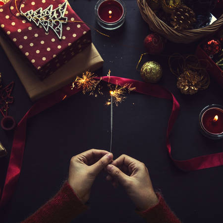 Overhead shot of Christmas presents and wrapping papersの写真素材