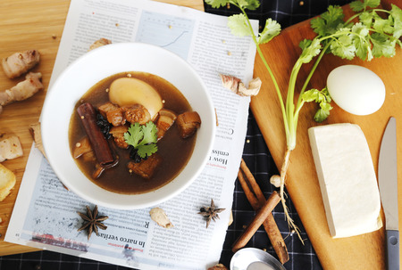 Thai cuisine (pa-lo)Eggs boiled soup with spices on wooden background.の写真素材