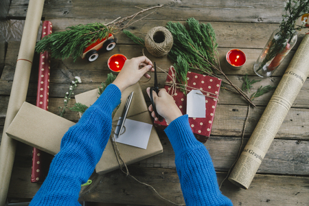 Woman preparing gifts for Christmasの写真素材