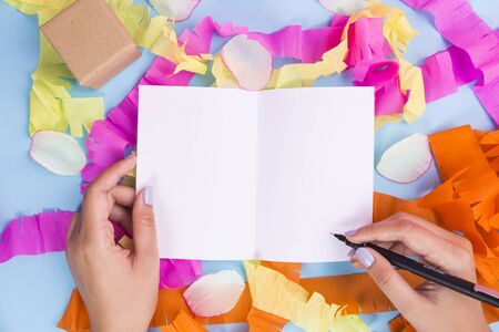 Women hand writing on white paper.の写真素材