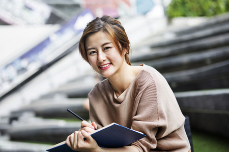 Asian woman reading the bookの写真素材