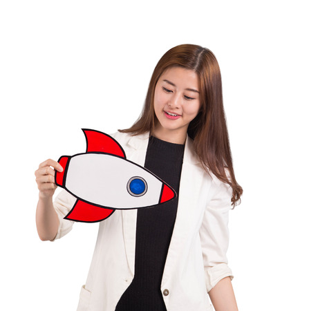 Woman playing rocket paper for startup conceptの写真素材