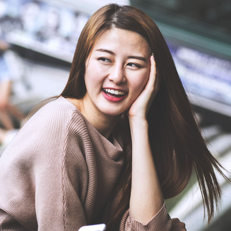 Asian student talking with her friend.
