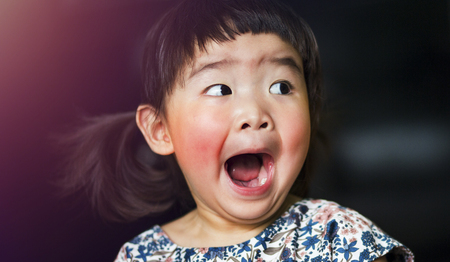 A little lovely asian girl feels shocked and open mouth wideの写真素材