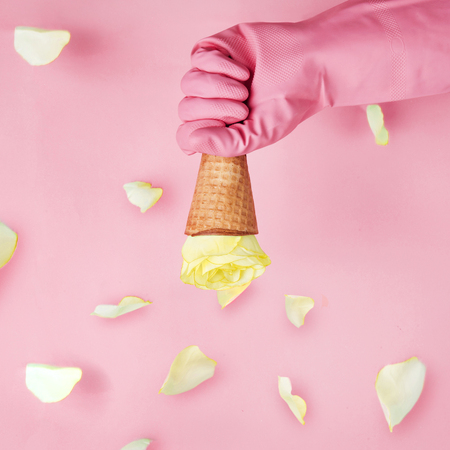 Holding Ice cream cone with yellow rose.valentine conceptの写真素材