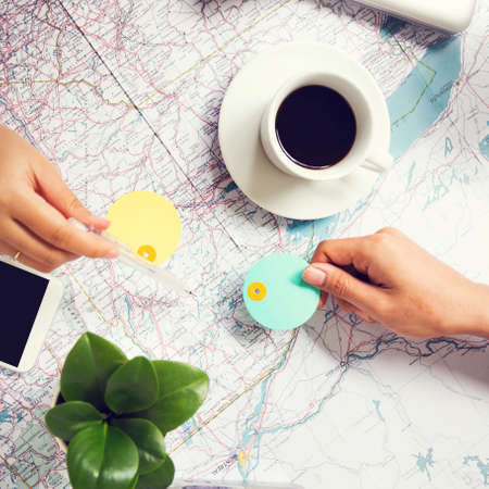 Planning for traveling on world map at workplaceの写真素材