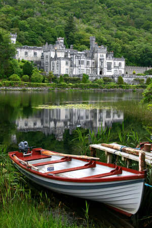 Motor boat and a beautiful Kylemore Abbeyの写真素材