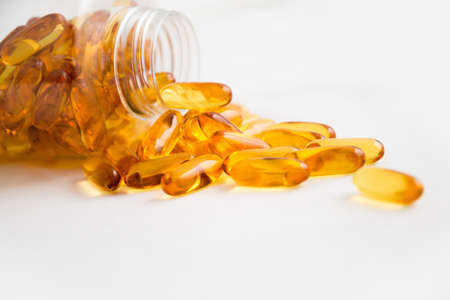 AIIMS hospital, New Delhi, December 9, 2018 Hemp CBD oil capsules spilled from a bottle and CBD...